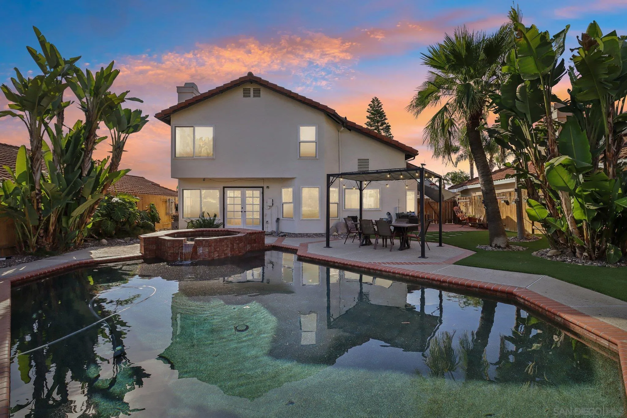 9186 Truman Street San Diego, CA 92129 - Photo 58 of 61 a front view of a house with yard and green space