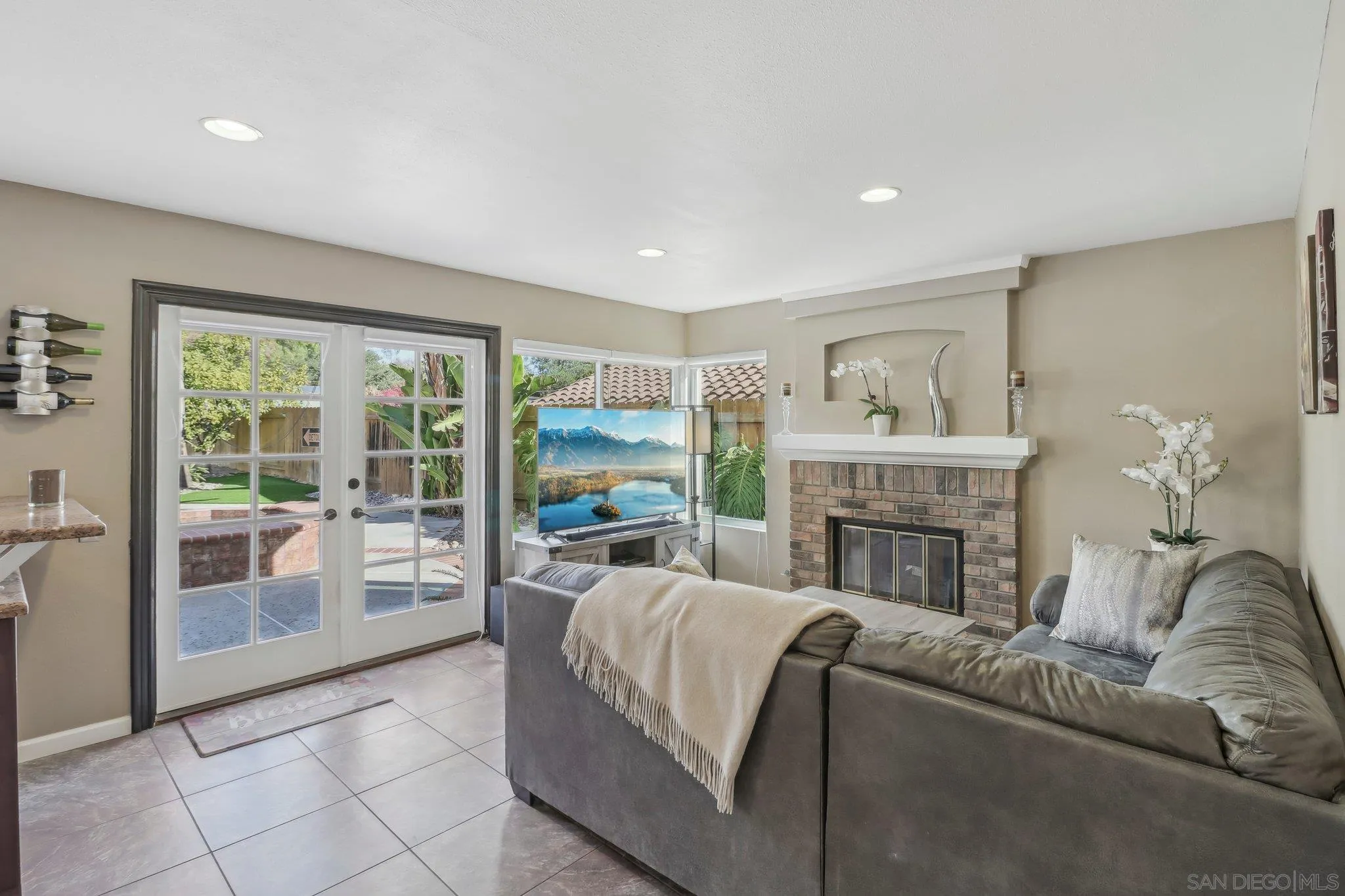 9186 Truman Street San Diego, CA 92129 - Photo 8 of 61 a living room with furniture and a fireplace