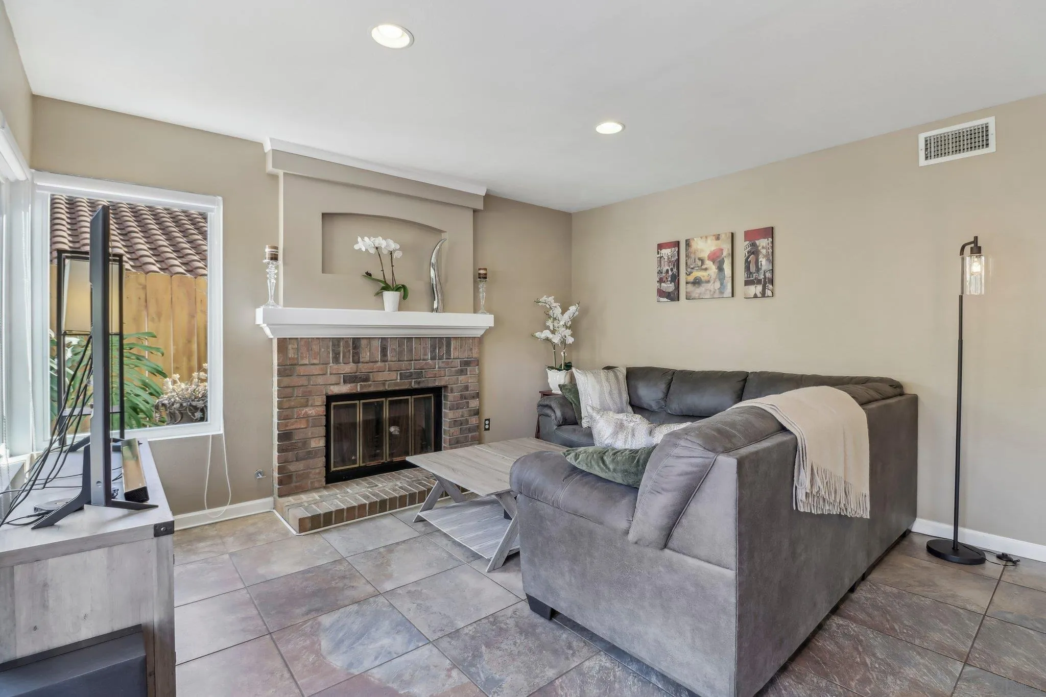 9186 Truman Street San Diego, CA 92129 - Photo 9 of 61 a living room with furniture and a fireplace