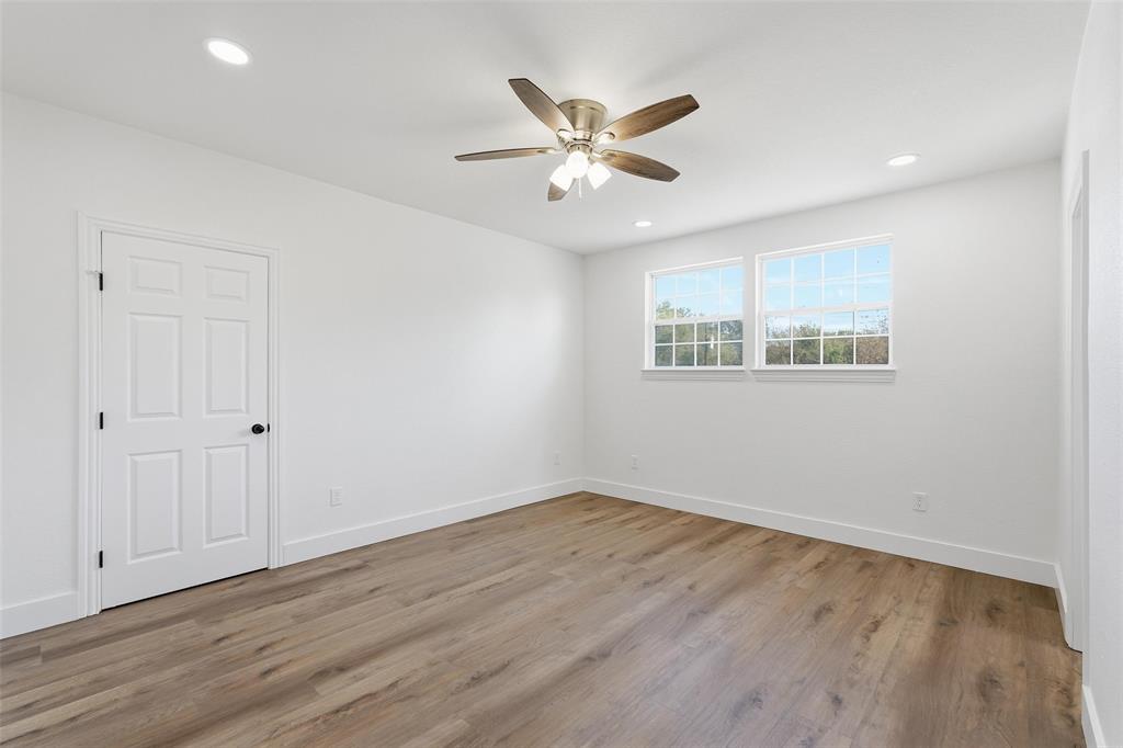 9938 John Flowers Road Wills Point, TX 75169 - Photo 33 of 40 Upstairs bedroom featuring light wood-style flooring, recessed lighting, and ceiling fan