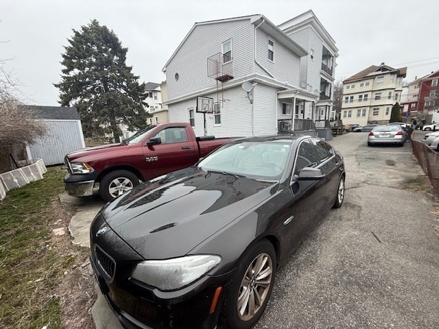513-515 Whipple Street Fall River, MA 02724 - Photo 38 of 41 a couple of cars parked in front of a house