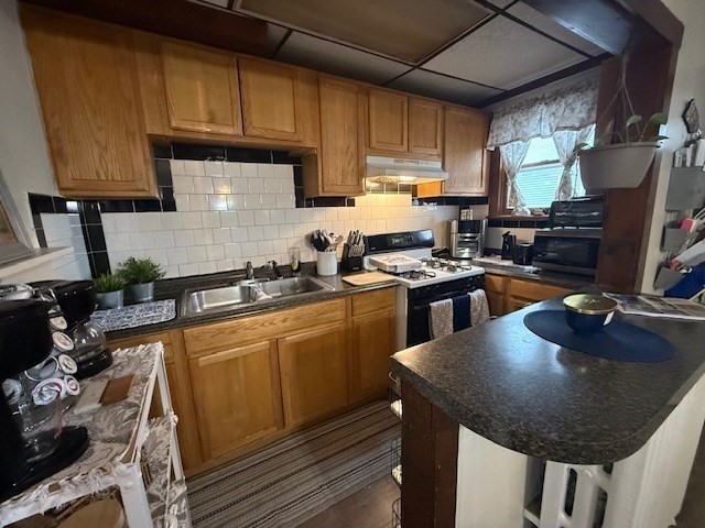 513-515 Whipple Street Fall River, MA 02724 - Photo 6 of 41 a kitchen with a sink a stove and chairs
