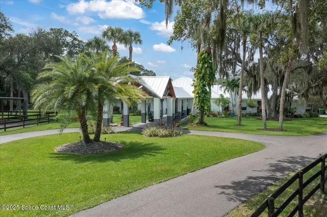 a garden with trees in front of it
