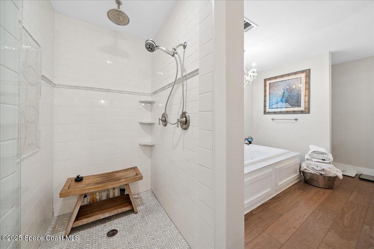 5685 Lake Washington Road Melbourne, FL 32934 - Photo 28 of 63 a bathroom with a window and a shower