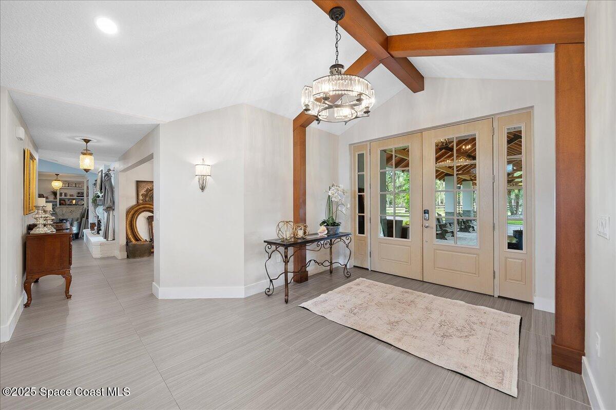 5685 Lake Washington Road Melbourne, FL 32934 - Photo 4 of 63 a view of a livingroom with furniture and windows