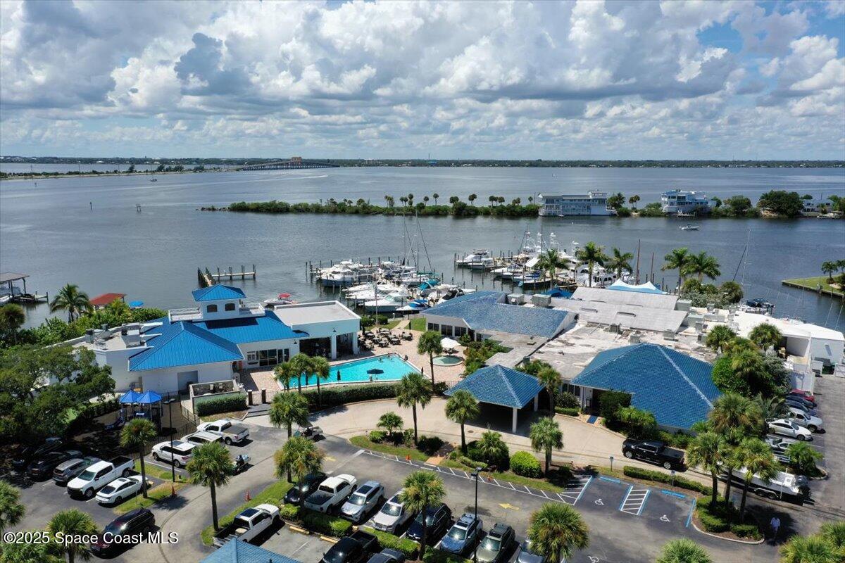 5685 Lake Washington Road Melbourne, FL 32934 - Photo 55 of 63 an aerial view of a house with a lake view