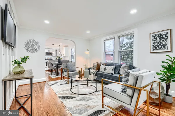 a living room with fireplace furniture and a flat screen tv