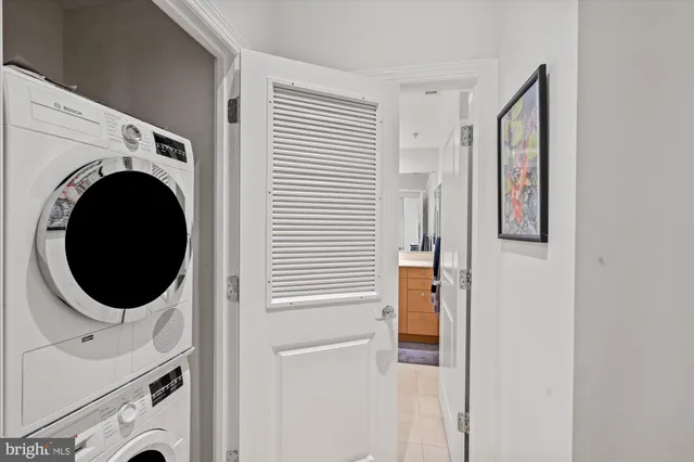a view of a hallway with washer and dryer