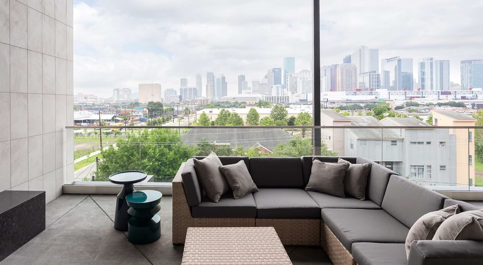 2425 Bell Street, Unit 2305 Houston, TX 77003 - Photo 16 of 30 a living room with furniture and a floor to ceiling window