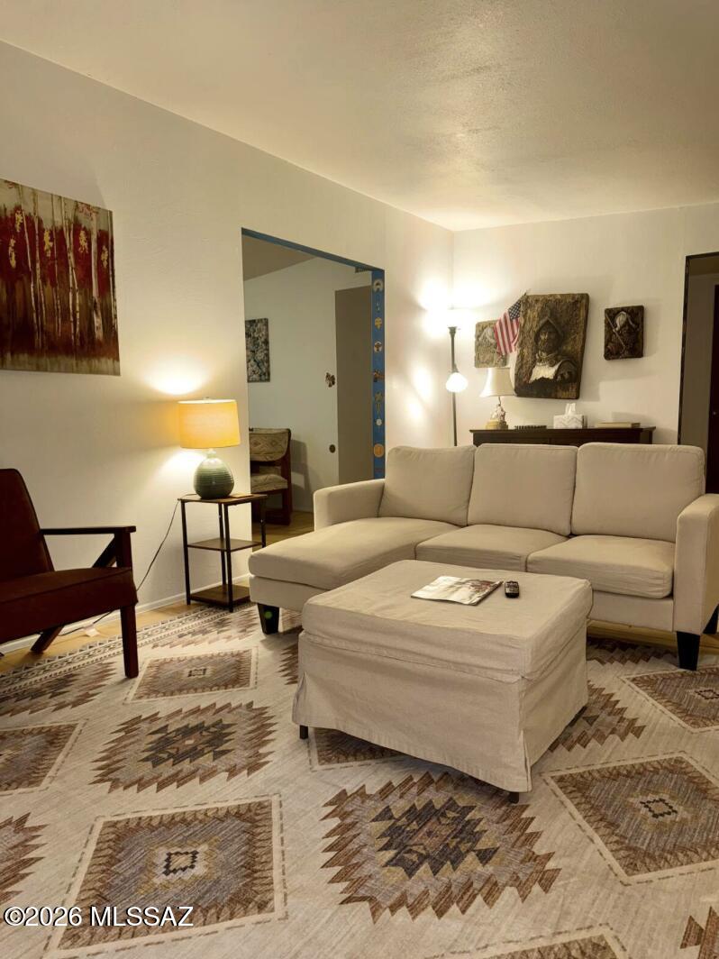 4415 North Swan Road Tucson, AZ 85718 - Photo 11 of 33 a bedroom with a bed and a couch
