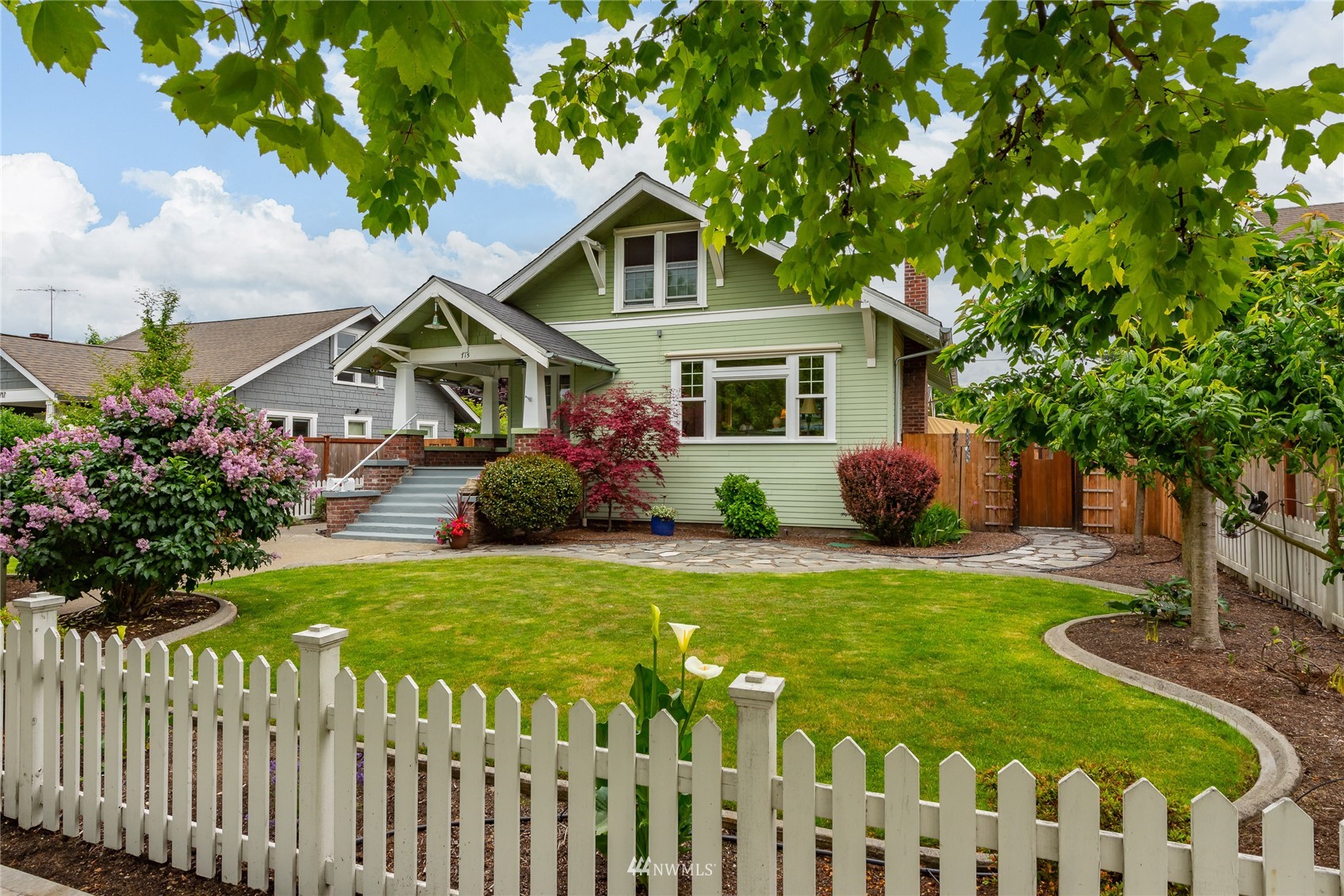 715 Sumner Avenue Sumner, WA 98390 - Photo 1 of 39 a front view of house with yard and green space