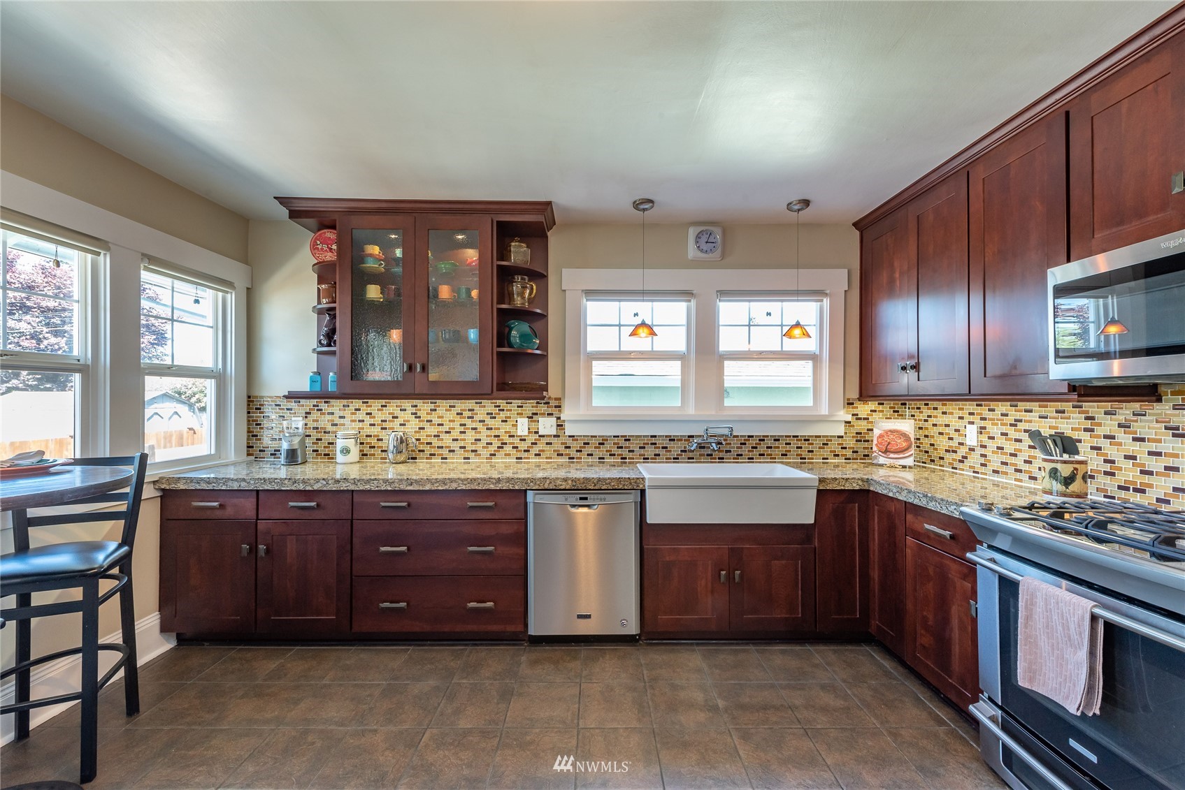 715 Sumner Avenue Sumner, WA 98390 - Photo 15 of 39 a kitchen with a sink stove and cabinets