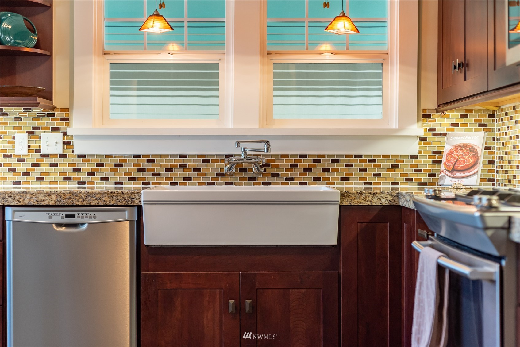 715 Sumner Avenue Sumner, WA 98390 - Photo 17 of 39 a bathroom with a sink a vanity and a window