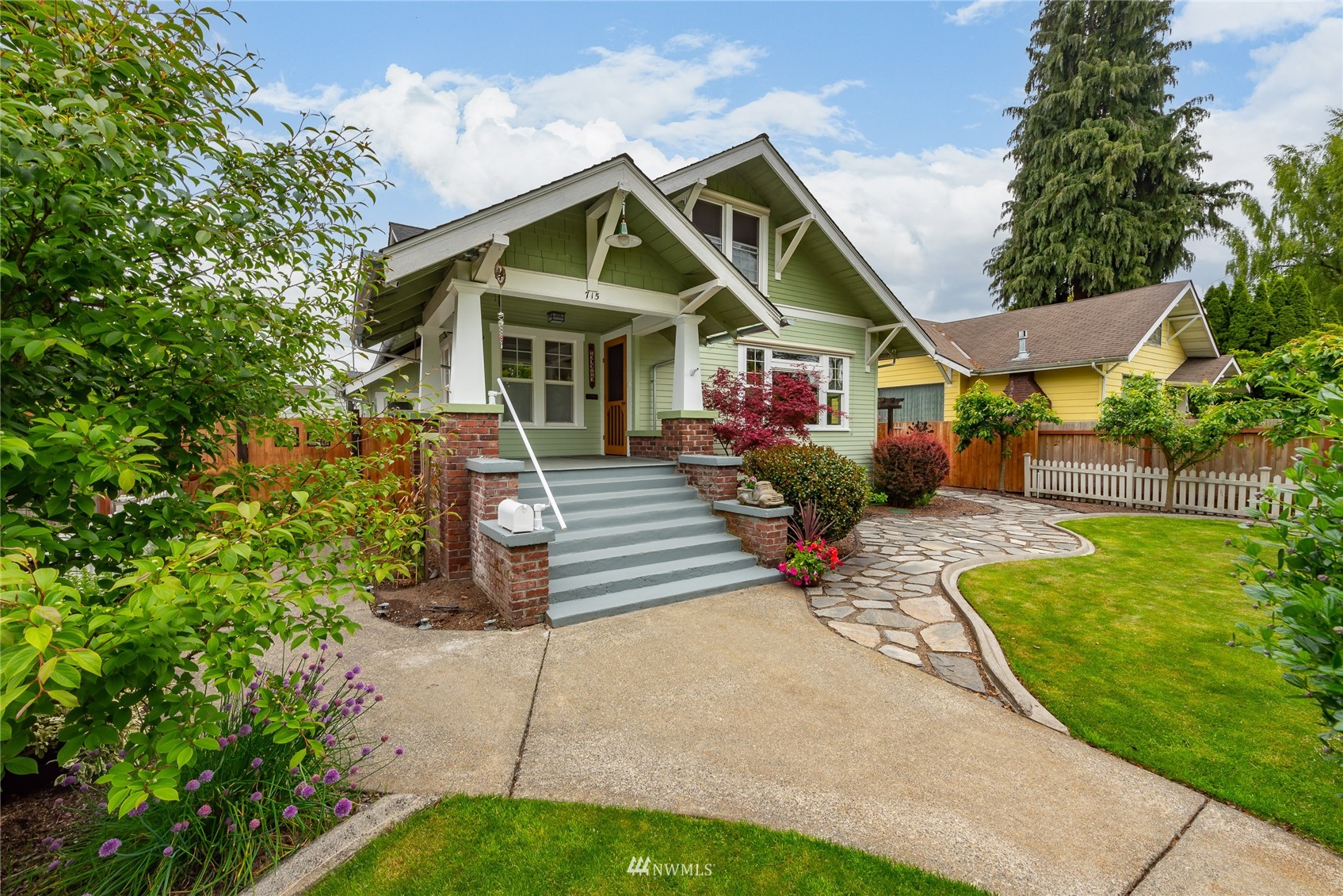 715 Sumner Avenue Sumner, WA 98390 - Photo 2 of 39 a view of a house with a yard