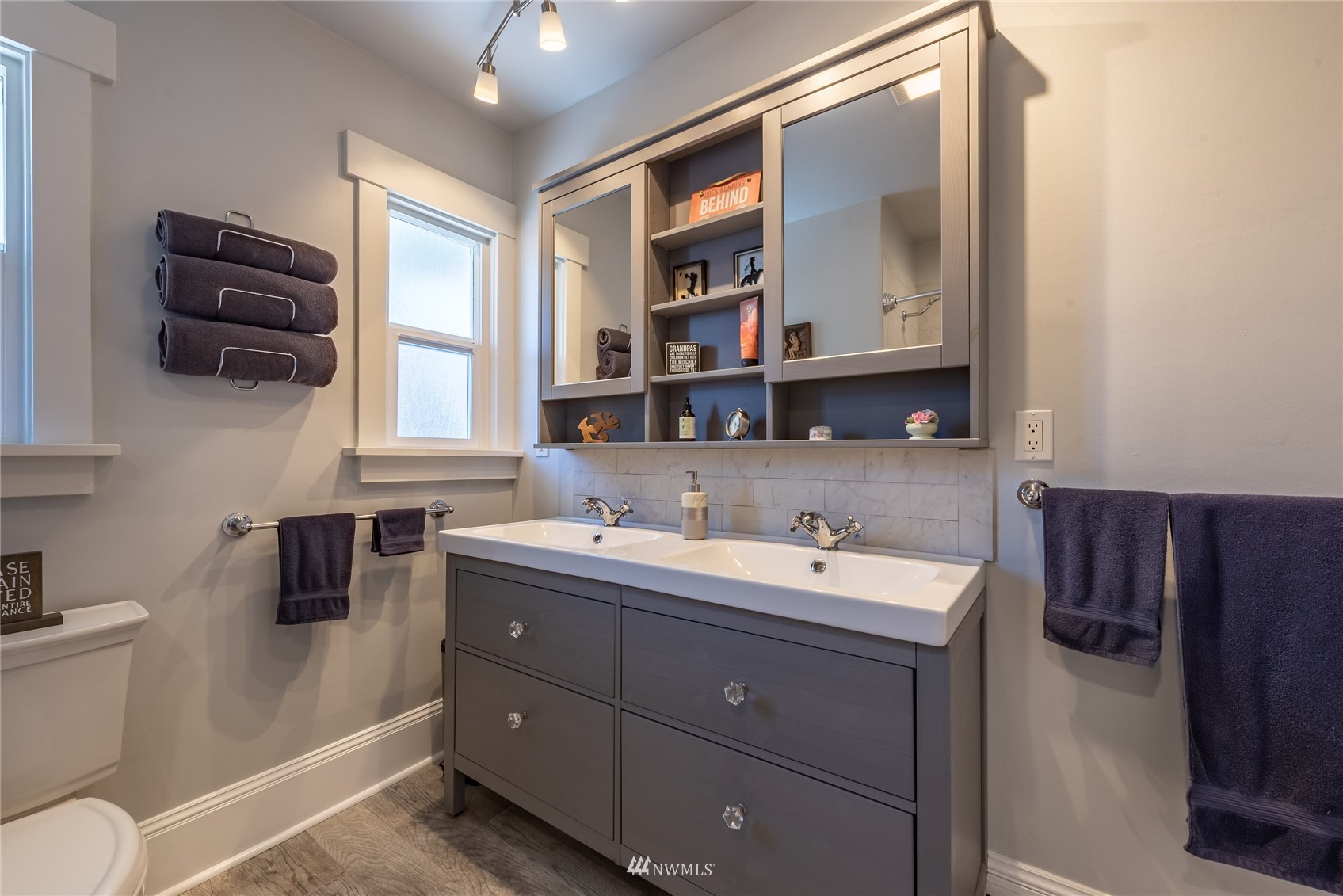 715 Sumner Avenue Sumner, WA 98390 - Photo 21 of 39 a bathroom with a double vanity sink mirror and toilet
