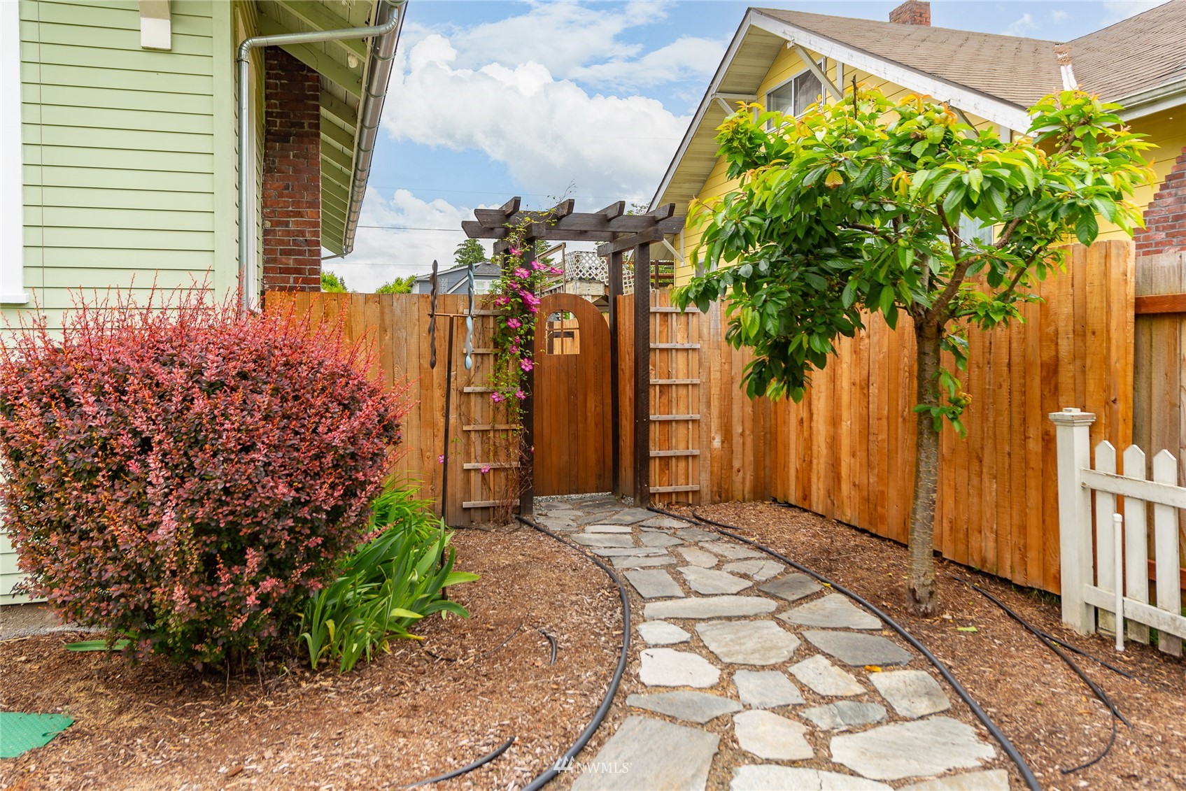 715 Sumner Avenue Sumner, WA 98390 - Photo 38 of 39 a view of a house with a backyard