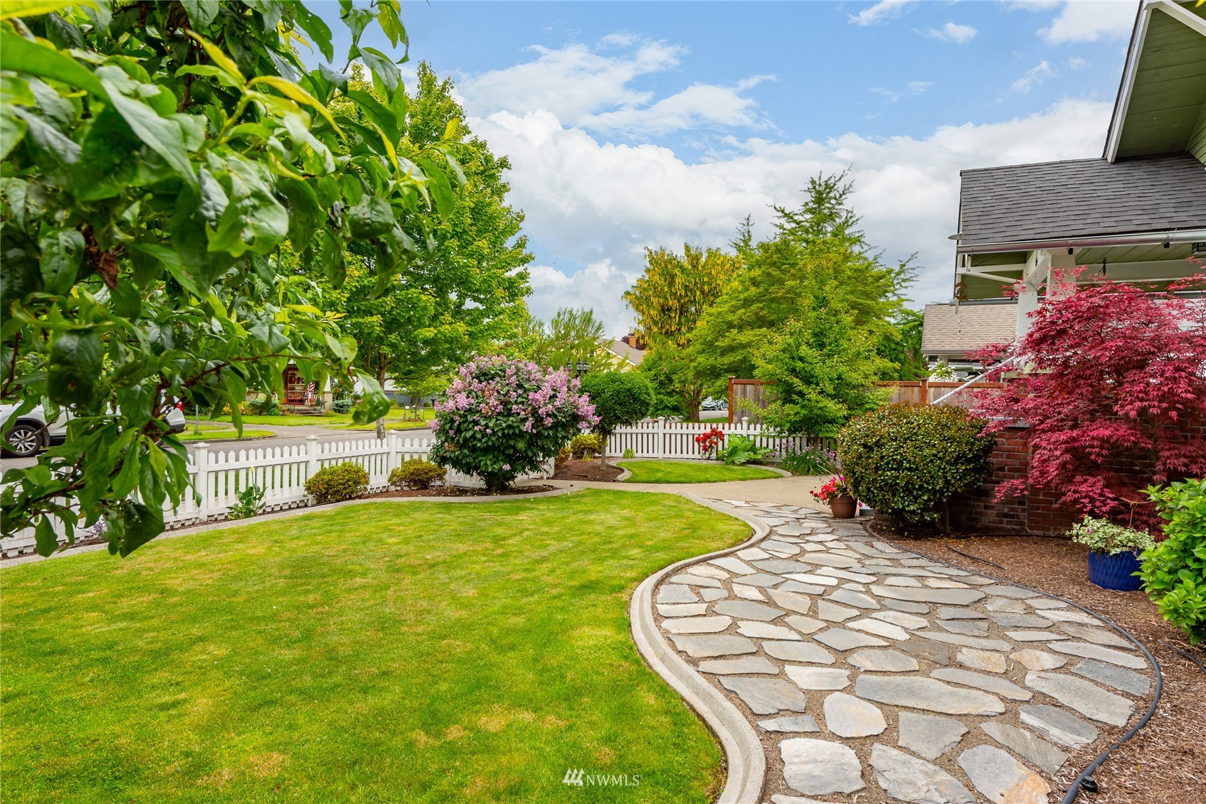 715 Sumner Avenue Sumner, WA 98390 - Photo 39 of 39 a view of a house with a yard porch and sitting area