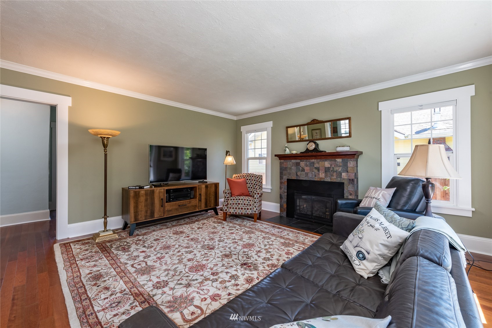 715 Sumner Avenue Sumner, WA 98390 - Photo 7 of 39 a living room with furniture and a fireplace