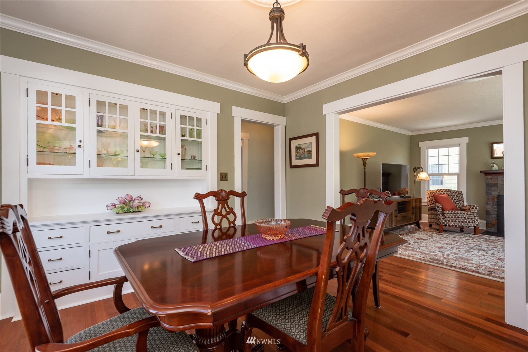 715 Sumner Avenue Sumner, WA 98390 - Photo 10 of 39 a view of a dining room with furniture window and wooden floor