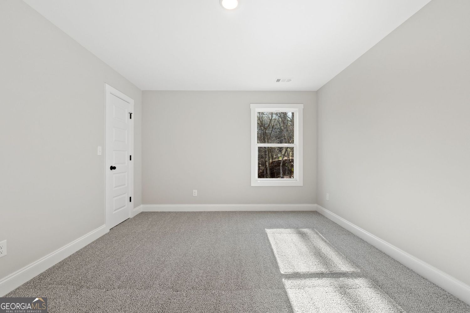 1578 English Road Forsyth, GA 31029 - Photo 27 of 39 an empty room with windows
