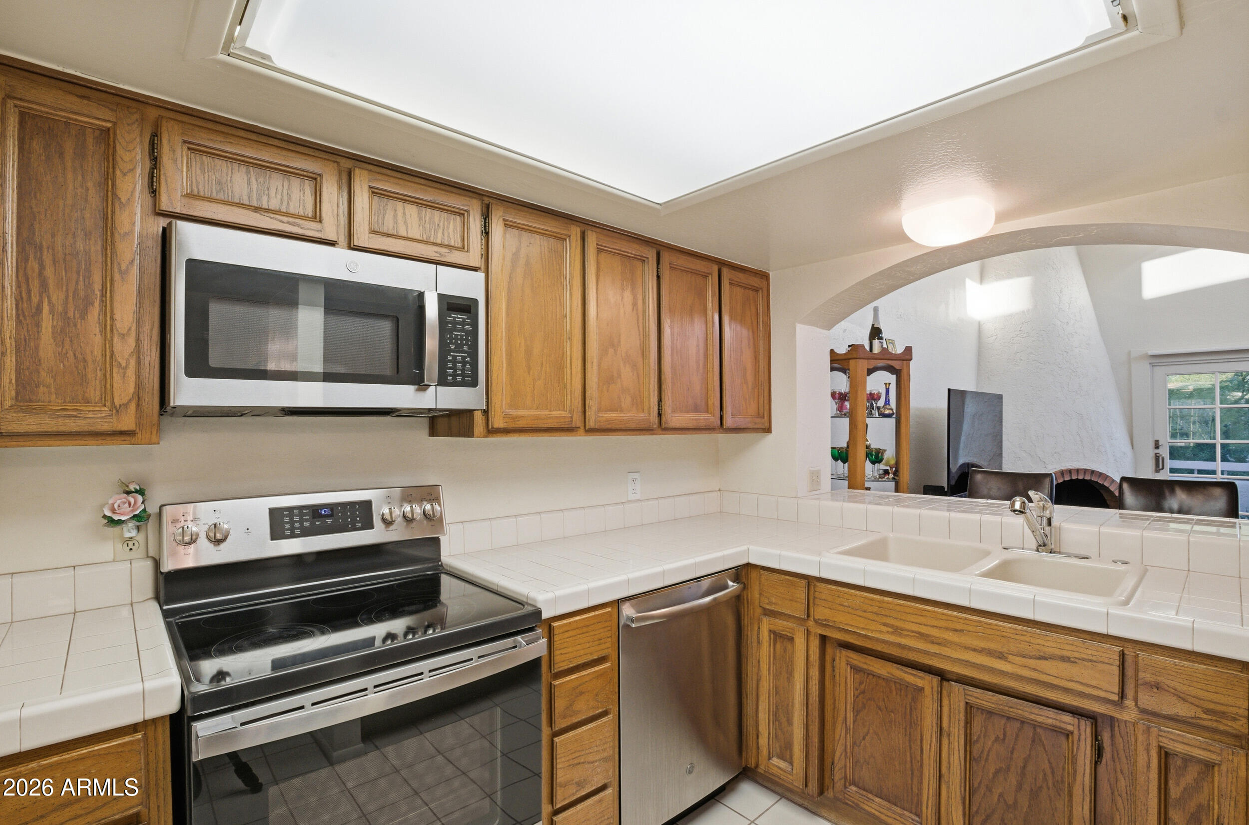 6150 North Scottsdale Road, Unit 52 Paradise Valley, AZ 85253 - Photo 12 of 24 a kitchen with a sink and steel appliances