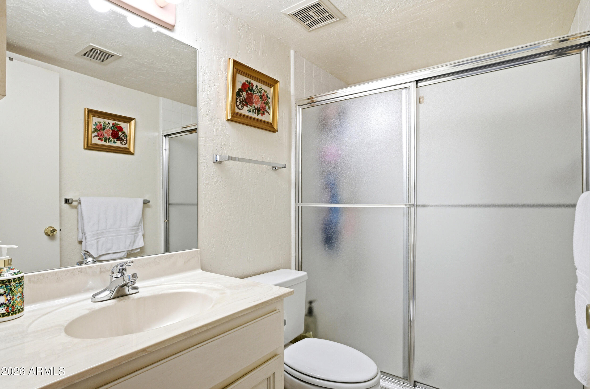6150 North Scottsdale Road, Unit 52 Paradise Valley, AZ 85253 - Photo 14 of 24 a bathroom with a sink toilet and shower