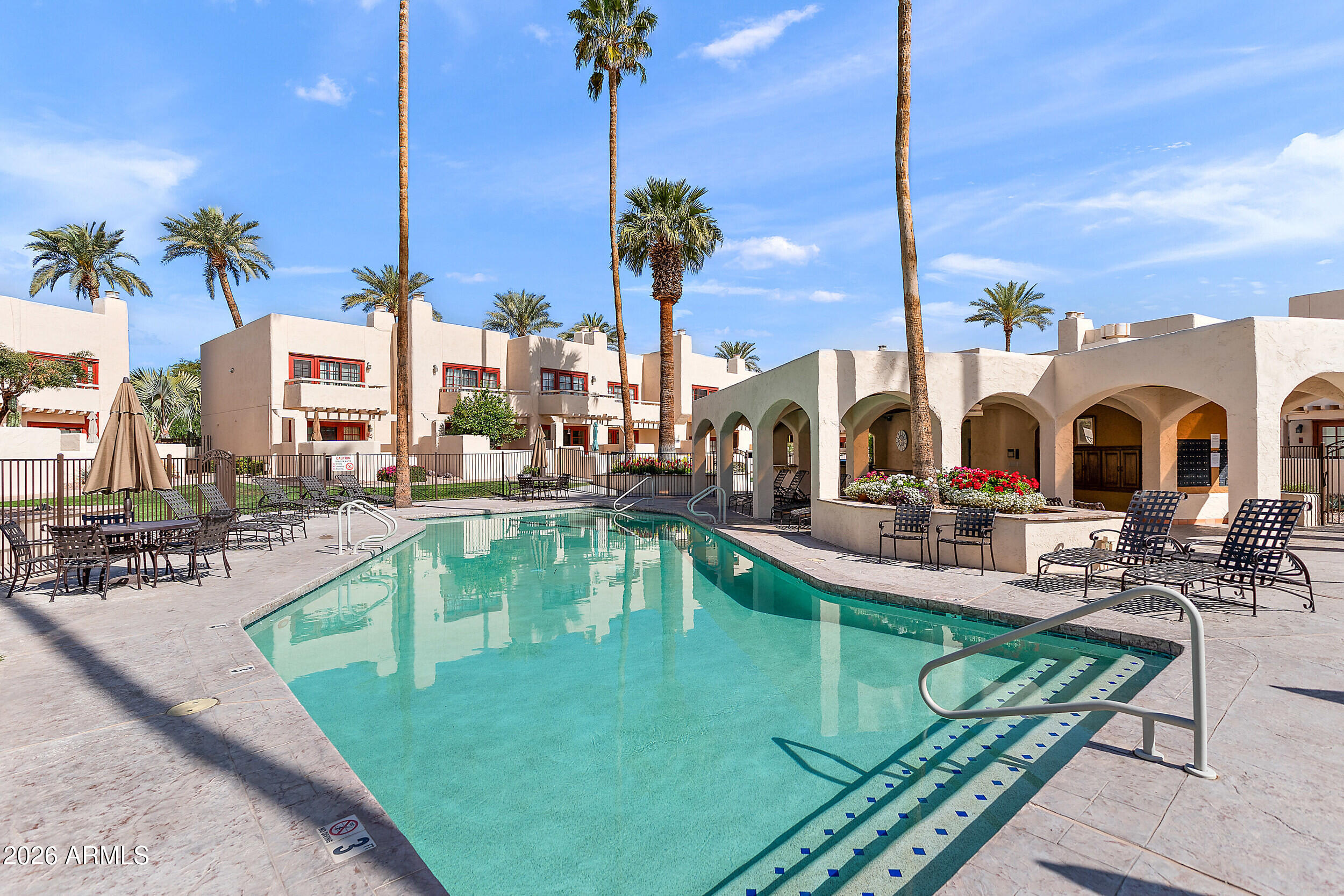 6150 North Scottsdale Road, Unit 52 Paradise Valley, AZ 85253 - Photo 20 of 24 a view of a house with swimming pool