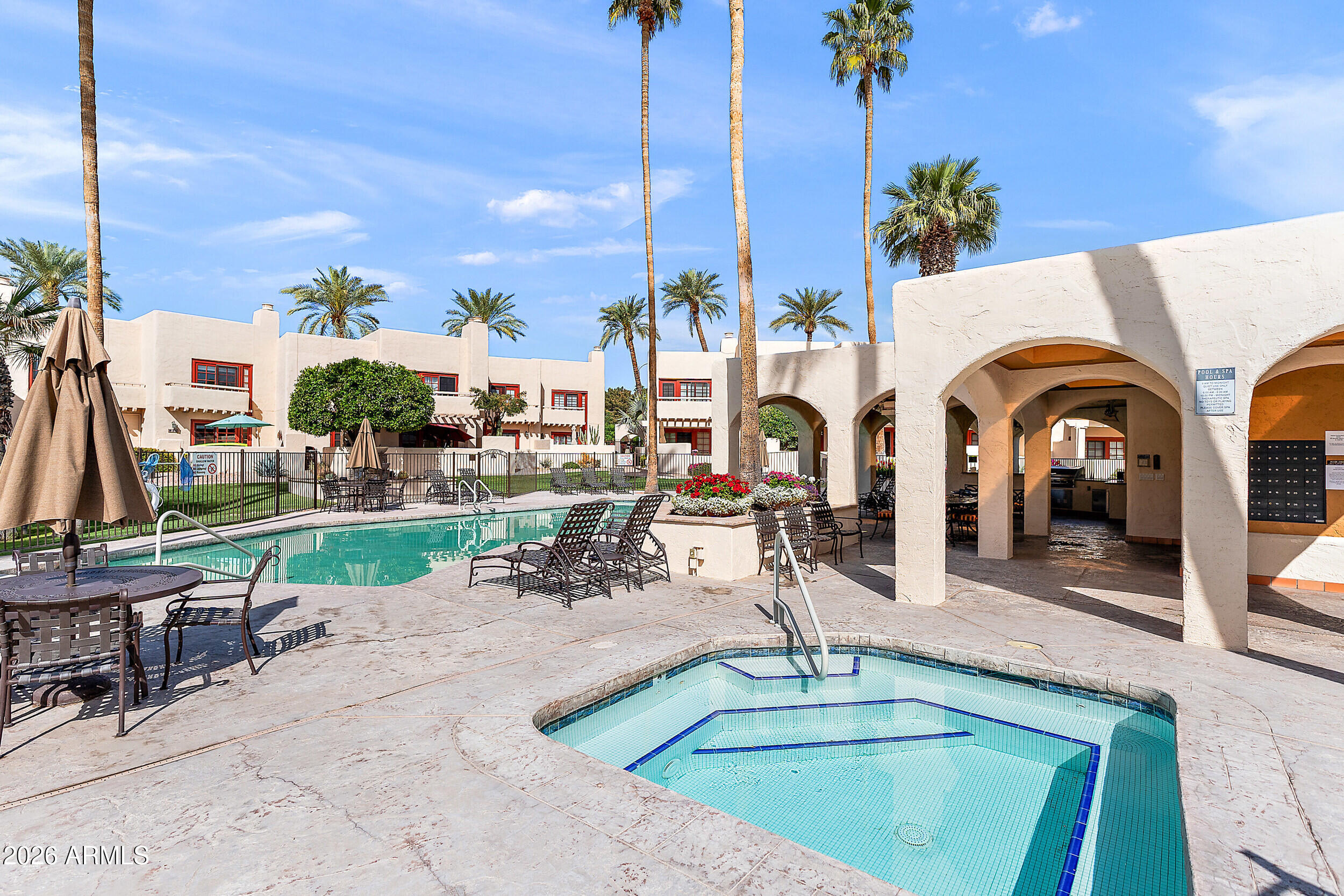 6150 North Scottsdale Road, Unit 52 Paradise Valley, AZ 85253 - Photo 22 of 24 a view of swimming pool with outdoor seating