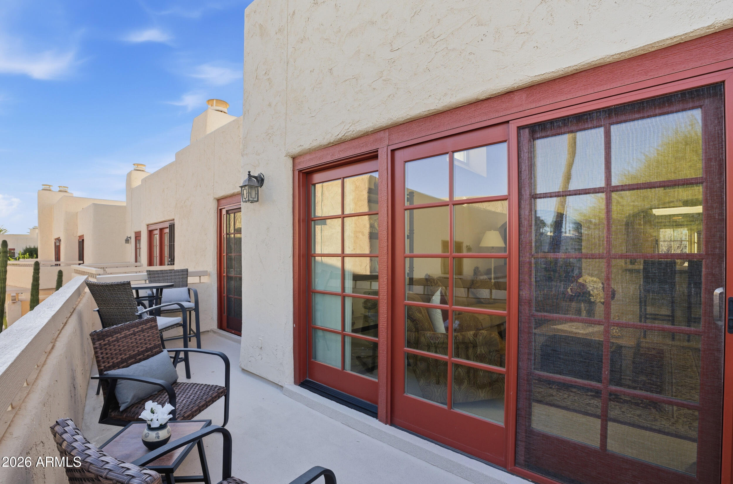 6150 North Scottsdale Road, Unit 52 Paradise Valley, AZ 85253 - Photo 8 of 24 a view of a living room and workspace with furniture