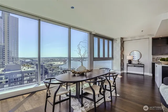 a view of a dining room with furniture window and wooden floor