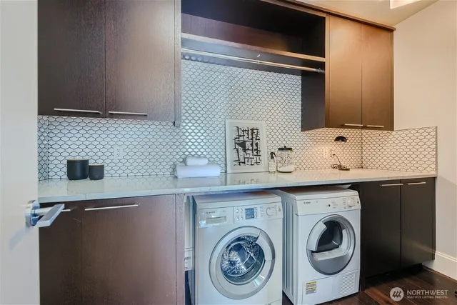 a view of storage and utility room with washer and dryer