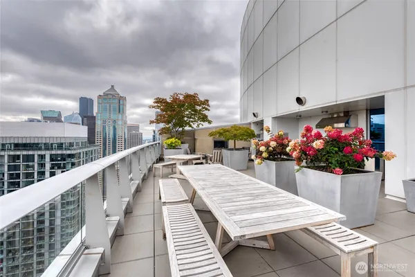a view of a balcony with seating space