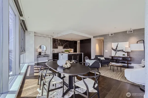 a view of a dining room with furniture and wooden floor