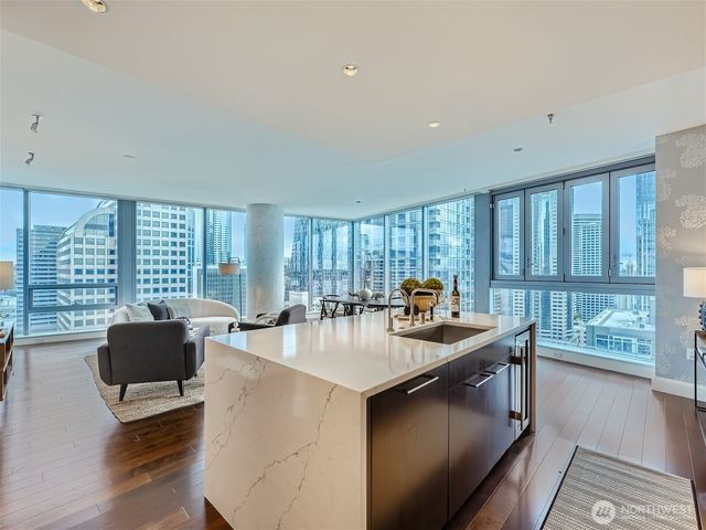 a kitchen with granite countertop a stove and a sink