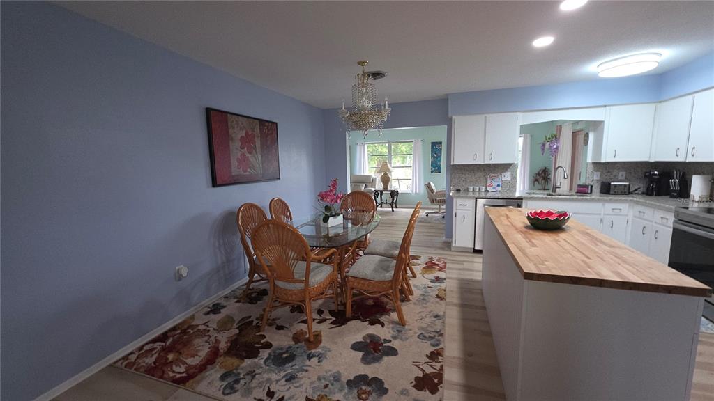 199 Caddy Road Rotonda West, FL 33947 - Photo 5 of 20 a large kitchen with a table and chairs