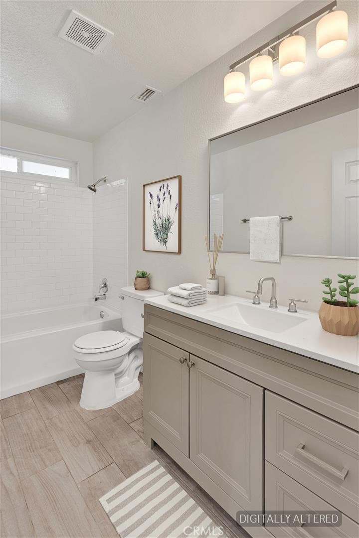21985 Maumee Road Apple Valley, CA 92308 - Photo 11 of 28 Guest Bathroom (Disclaimer: Some images have been digitally enhanced with virtual staging to illustrate potential room layouts and furnishings. Actual property condition and features may vary. Buyer to verify all information independently).