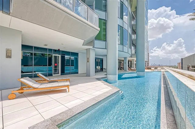 a view of a living room with a floor to ceiling window