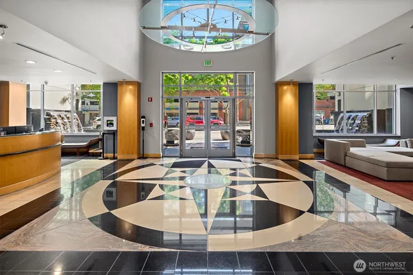 a dining table with chairs and a chandelier