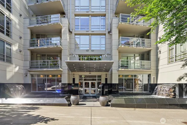 a front view of building with cars parked