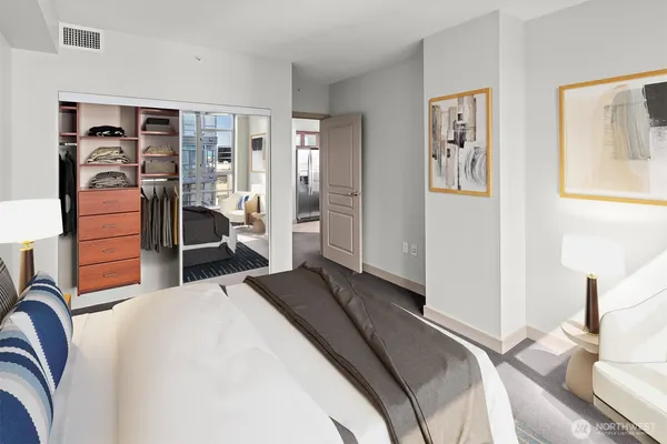 a bedroom with a bed and a view of bedroom