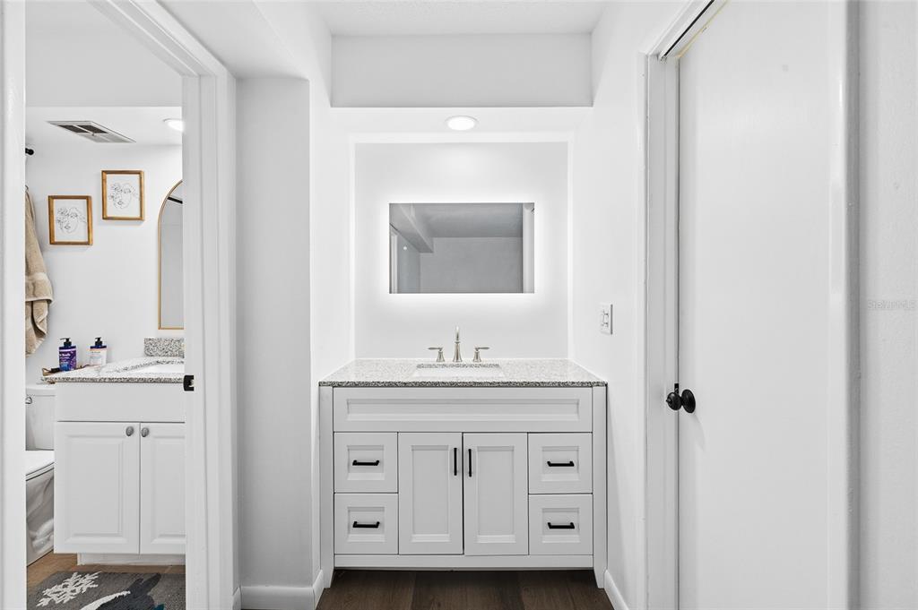 2209 Belleair Road, Unit C5 Clearwater, FL 33764 - Photo 16 of 30 a bathroom with a sink vanity and mirror