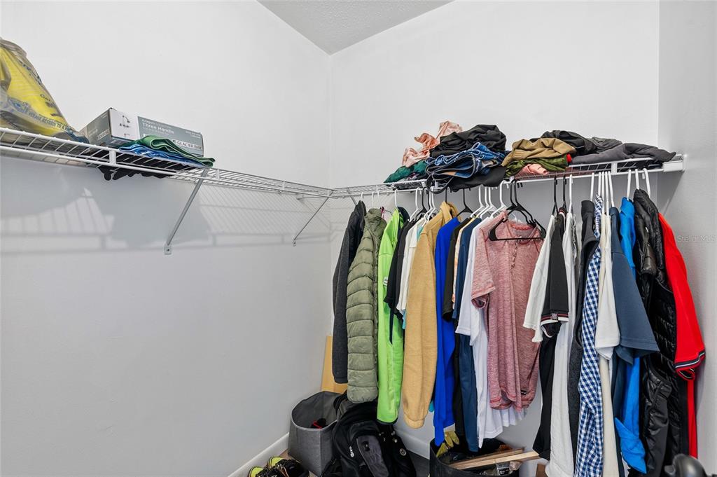 2209 Belleair Road, Unit C5 Clearwater, FL 33764 - Photo 17 of 30 a view of walk in closet with clothes and shoes