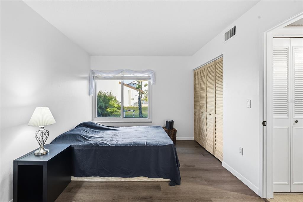 2209 Belleair Road, Unit C5 Clearwater, FL 33764 - Photo 19 of 30 a bedroom with a bed and a window