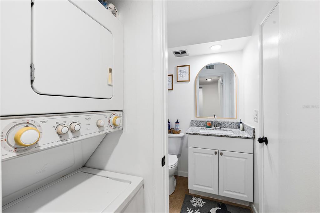 2209 Belleair Road, Unit C5 Clearwater, FL 33764 - Photo 23 of 30 a bathroom with a toilet sink and mirror