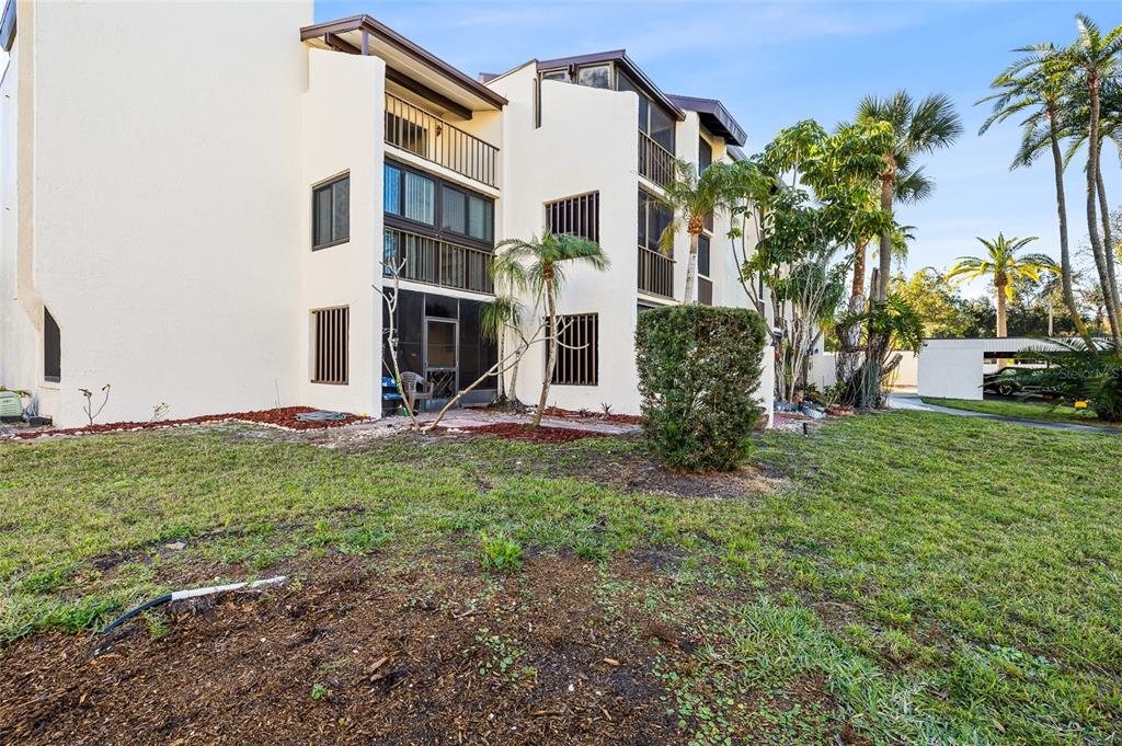 2209 Belleair Road, Unit C5 Clearwater, FL 33764 - Photo 24 of 30 a view of a house with a yard