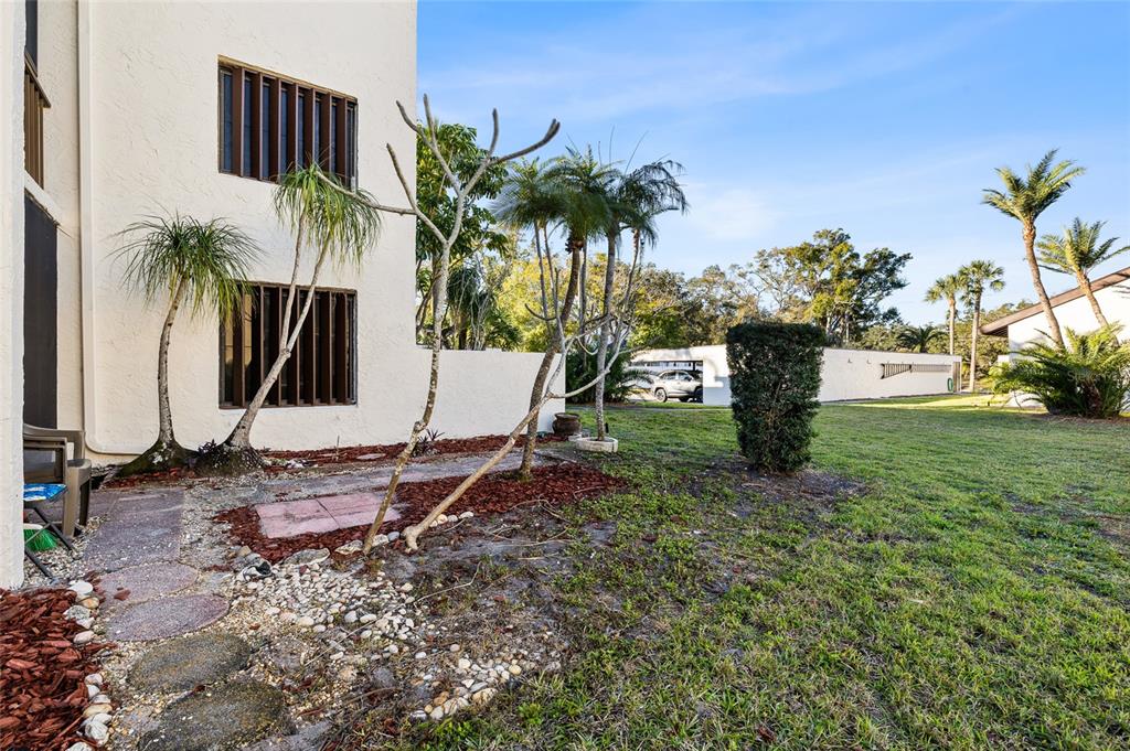 2209 Belleair Road, Unit C5 Clearwater, FL 33764 - Photo 25 of 30 a view of outdoor space with garden