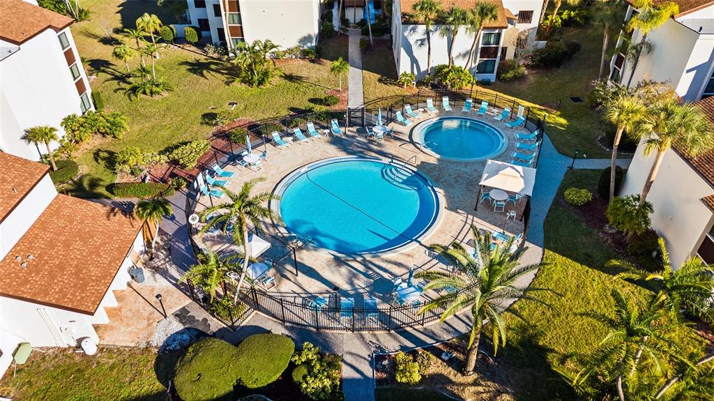 2209 Belleair Road, Unit C5 Clearwater, FL 33764 - Photo 28 of 30 an aerial view of a swimming pool with outdoor seating
