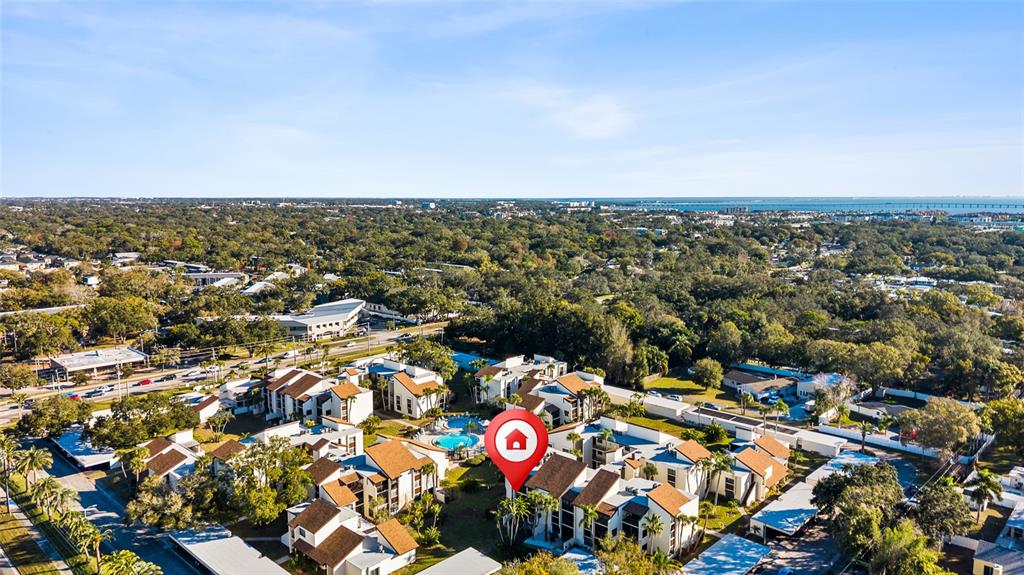 2209 Belleair Road, Unit C5 Clearwater, FL 33764 - Photo 30 of 30 an aerial view of multiple house with yard