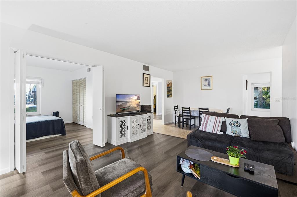 2209 Belleair Road, Unit C5 Clearwater, FL 33764 - Photo 8 of 30 a living room with furniture and a flat screen tv