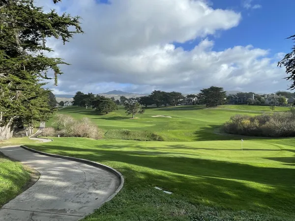 a view of a golf course with a lake